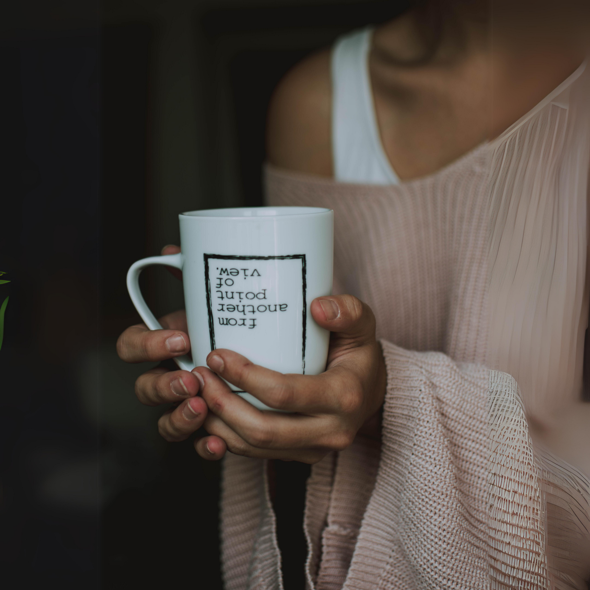 Holding a mug with saying - from another point of view.